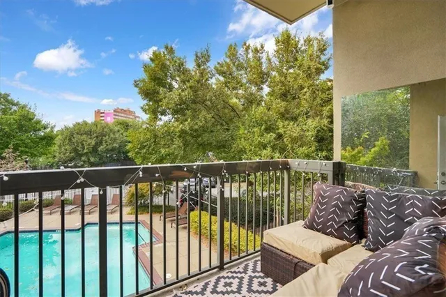 a bedroom with two beds and a couch