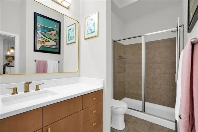 a bedroom with a bed and walk in closet