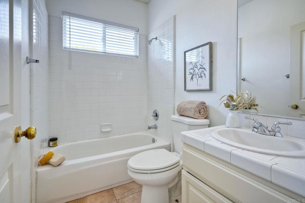 1026 Turnstone Road Carlsbad, CA 92011 - Photo 16 of 38 a bathroom with a bathtub sink and toilet
