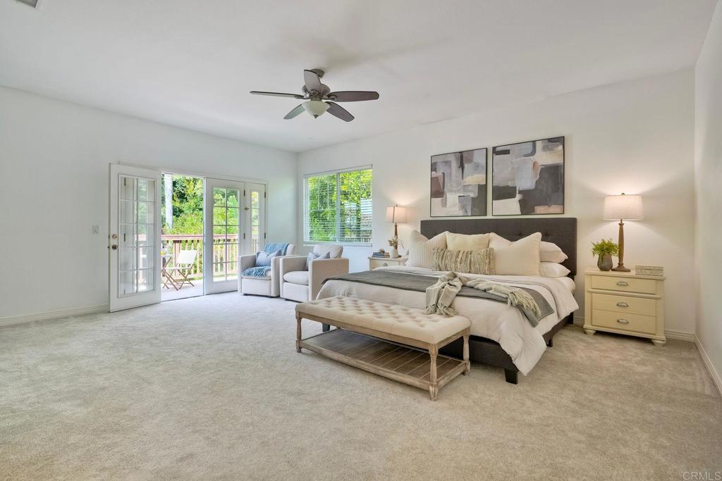 1026 Turnstone Road Carlsbad, CA 92011 - Photo 19 of 38 a spacious bedroom with a bed and a large window