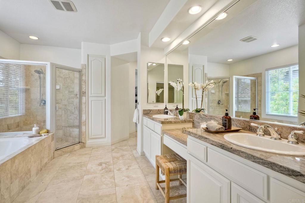 1026 Turnstone Road Carlsbad, CA 92011 - Photo 22 of 38 a bathroom with a sink double vanity and a shower