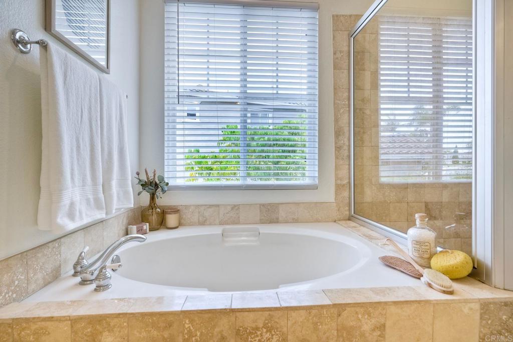 1026 Turnstone Road Carlsbad, CA 92011 - Photo 25 of 38 a bath tub sitting in a bathroom next to a window