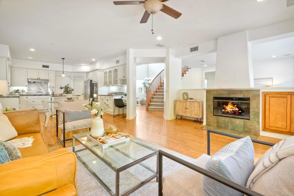 1026 Turnstone Road Carlsbad, CA 92011 - Photo 3 of 38 a living room with fireplace furniture and a wooden floor