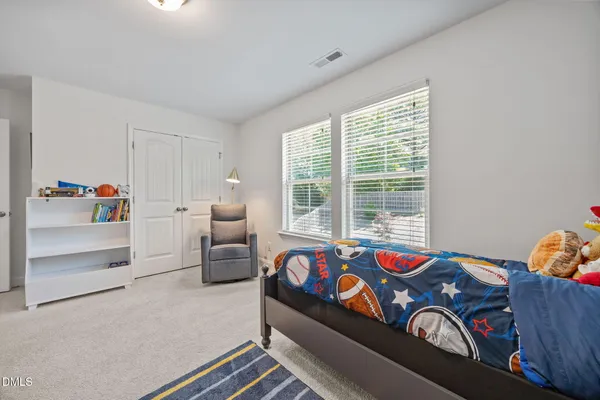 a bathroom with a shower curtain and a toilet