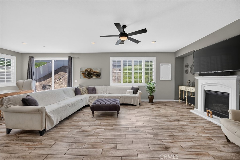 23347 Crystal Way Wildomar, CA 92595 - Photo 13 of 109 a living room with furniture fireplace and flat screen tv