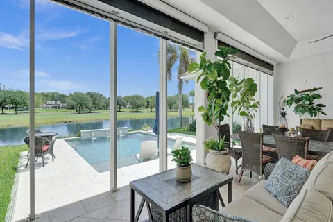 a living room with furniture rug and window