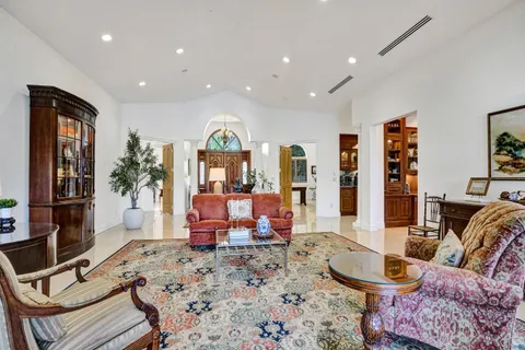 a kitchen with stainless steel appliances granite countertop a stove refrigerator and cabinets