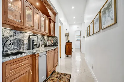 a bedroom with a bed dresser and a window