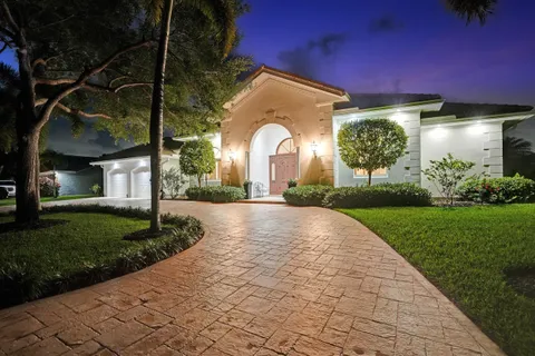 a living room with furniture a floor to ceiling window and a table