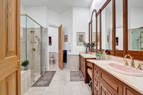 a living room with furniture ceiling fan and a window