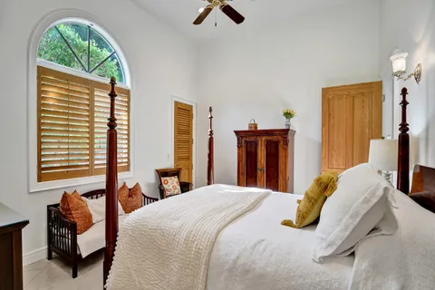 a dining room with furniture and a large window