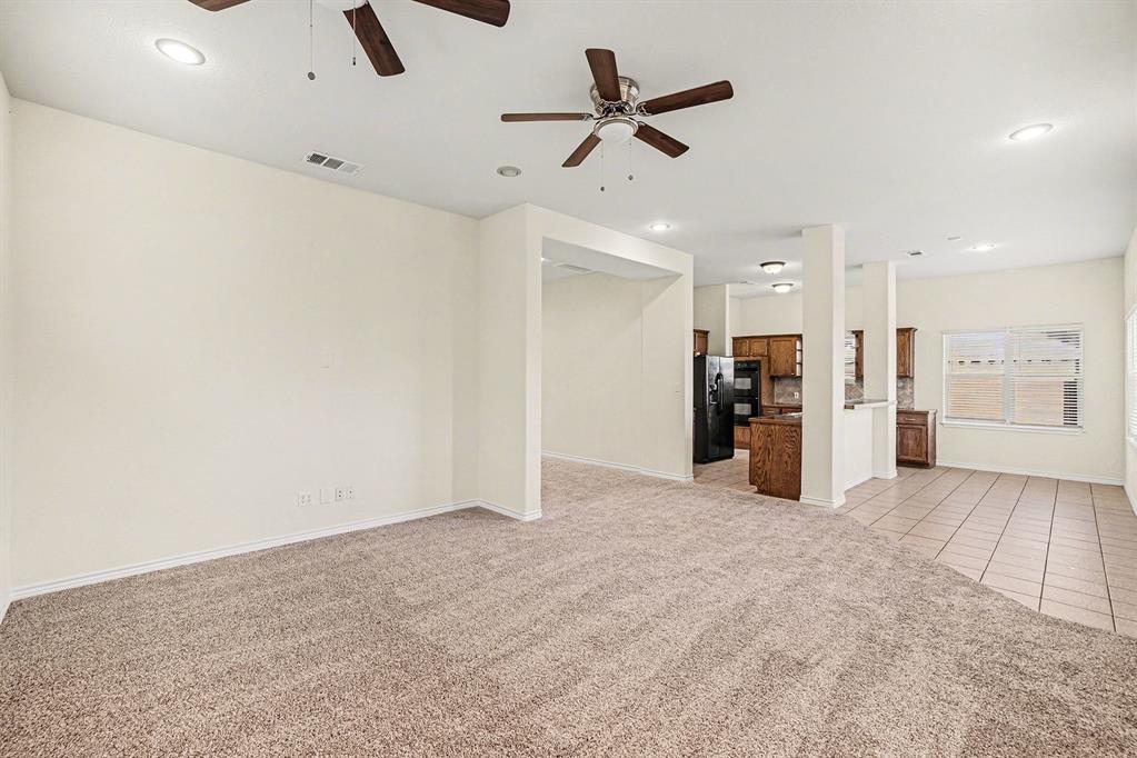 208 Cobblestone Circle Red Oak, TX 75154 - Photo 12 of 38 a view of an empty room with a window