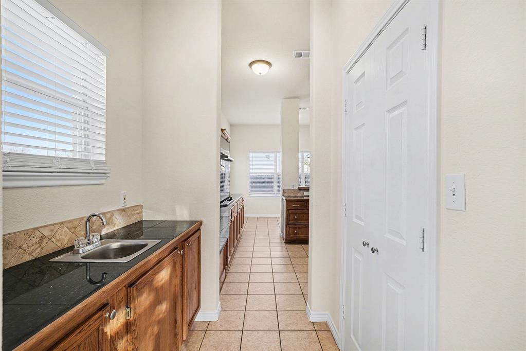 208 Cobblestone Circle Red Oak, TX 75154 - Photo 16 of 38 a bathroom with a sink and a mirror