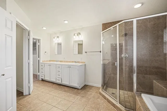 an empty room with fan and entrance