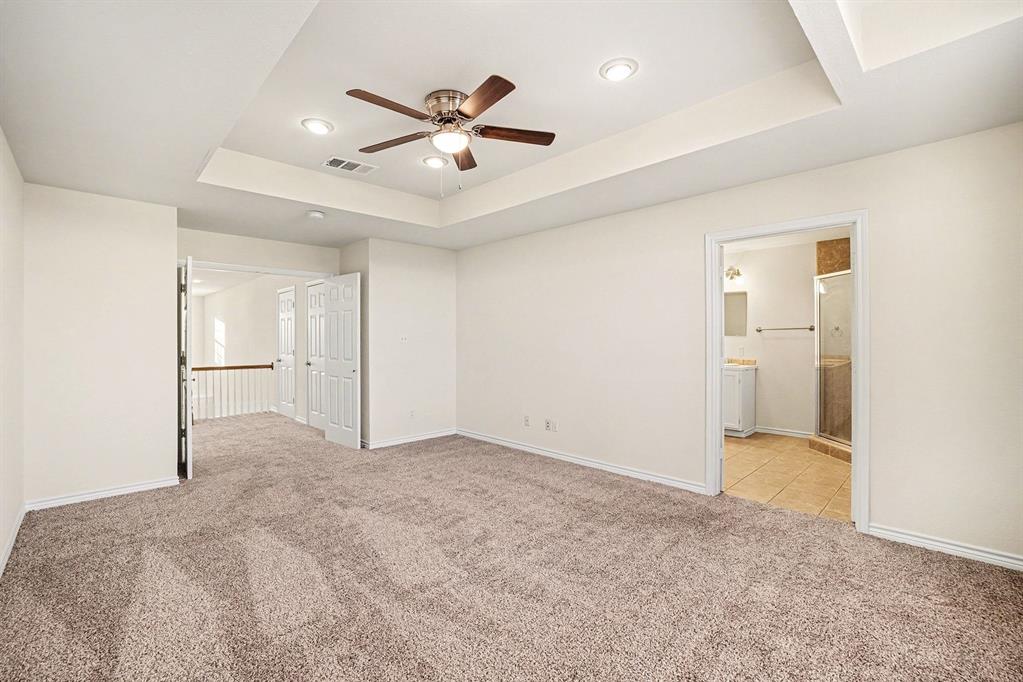 208 Cobblestone Circle Red Oak, TX 75154 - Photo 29 of 38 an empty room with fan and entrance