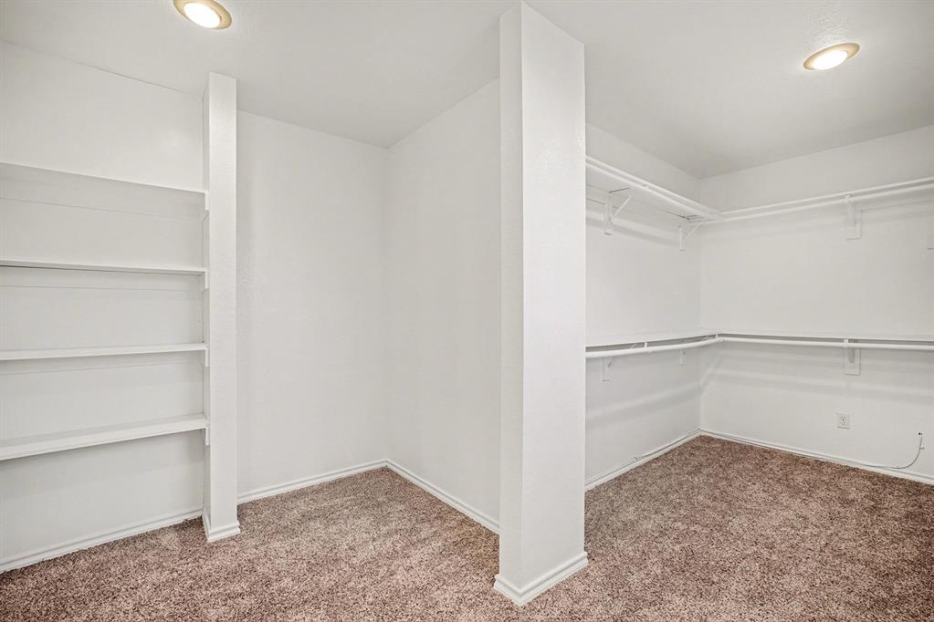 208 Cobblestone Circle Red Oak, TX 75154 - Photo 36 of 38 a view of an empty walk in closet