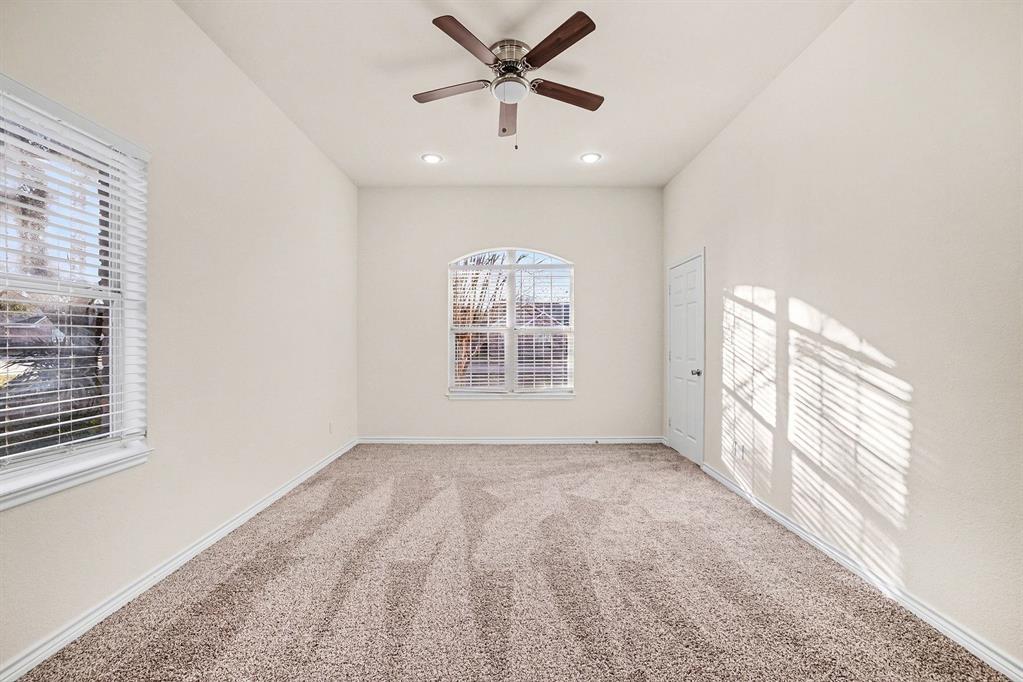 208 Cobblestone Circle Red Oak, TX 75154 - Photo 9 of 38 a view of an empty room with a window