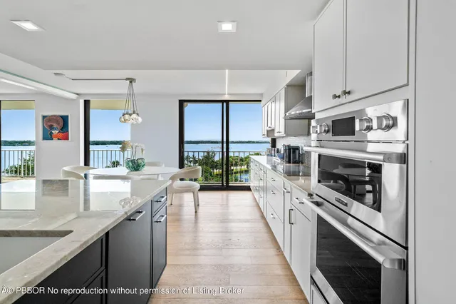 a kitchen with stainless steel appliances granite countertop a stove and a sink