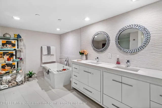 a bathroom with a sink mirror and vanity