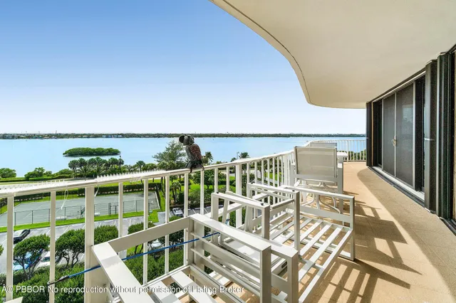 a view of a balcony with chairs