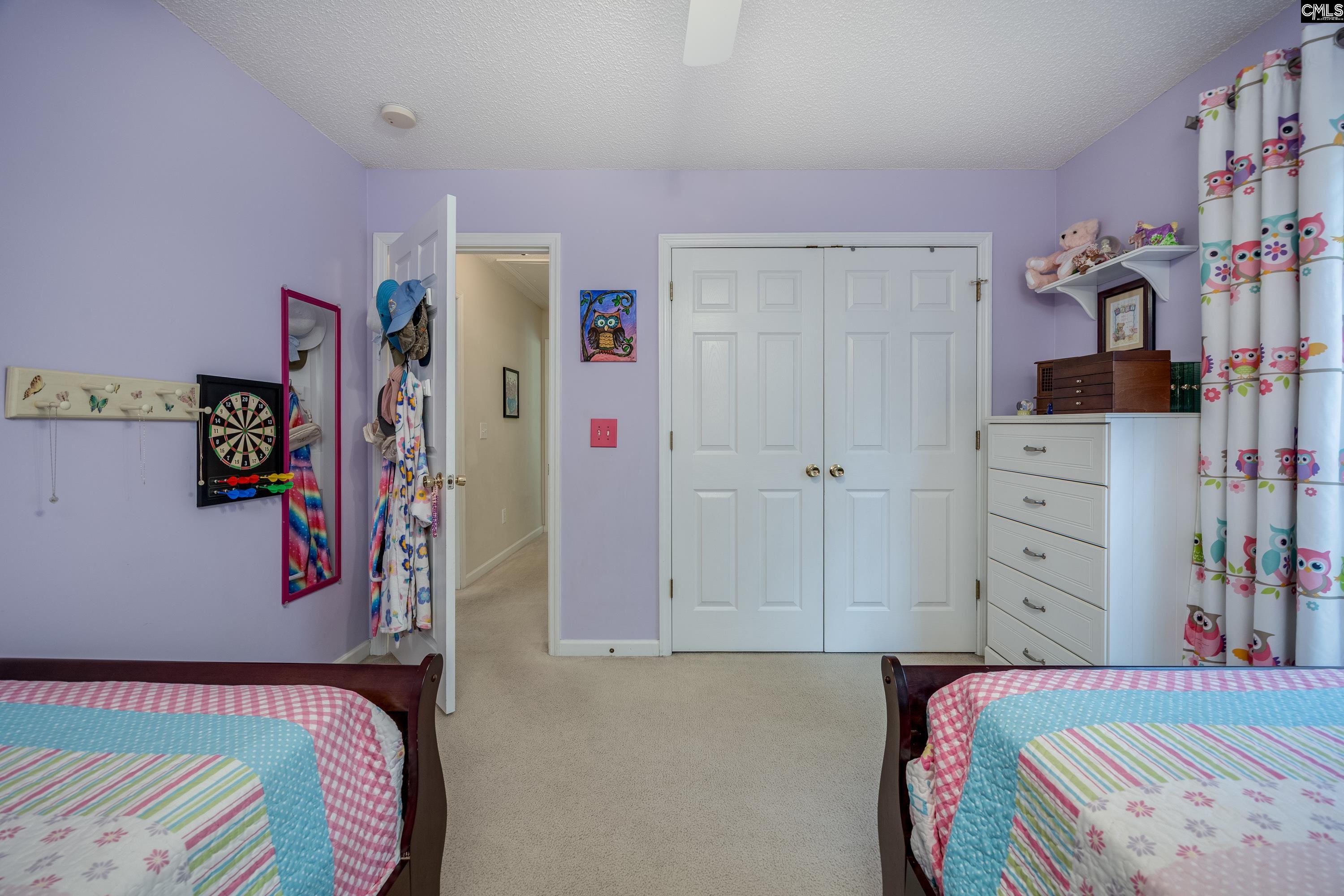 2032 Ridgeway Road Lugoff, SC 29078 - Photo 36 of 57 a bedroom with a bed and a walk in closet
