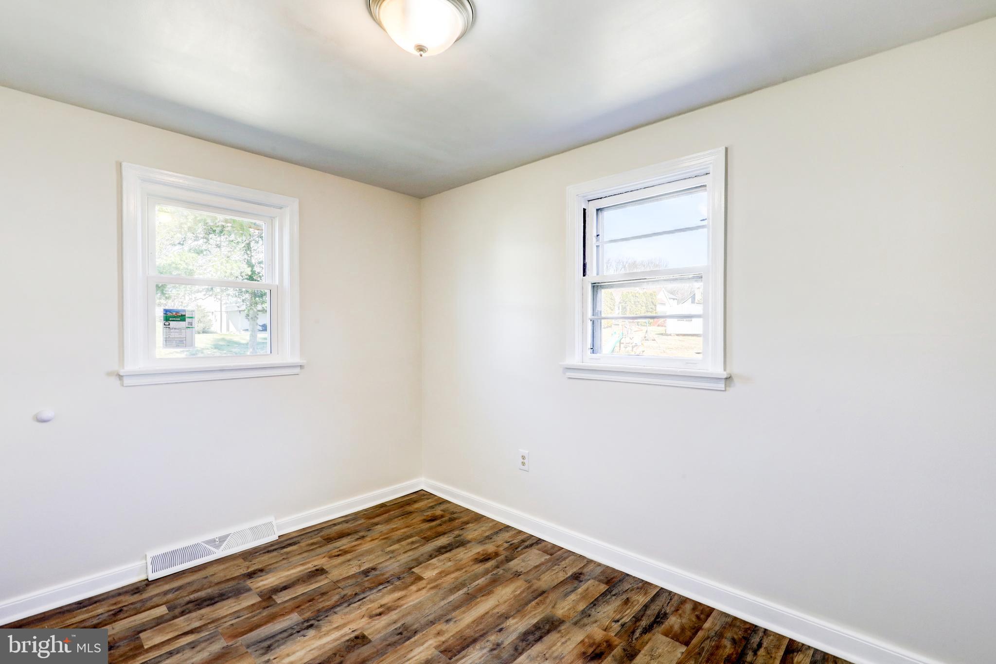215 Akron Road Ephrata, PA 17522 - Photo 12 of 24 wooden floor in an empty room with a window