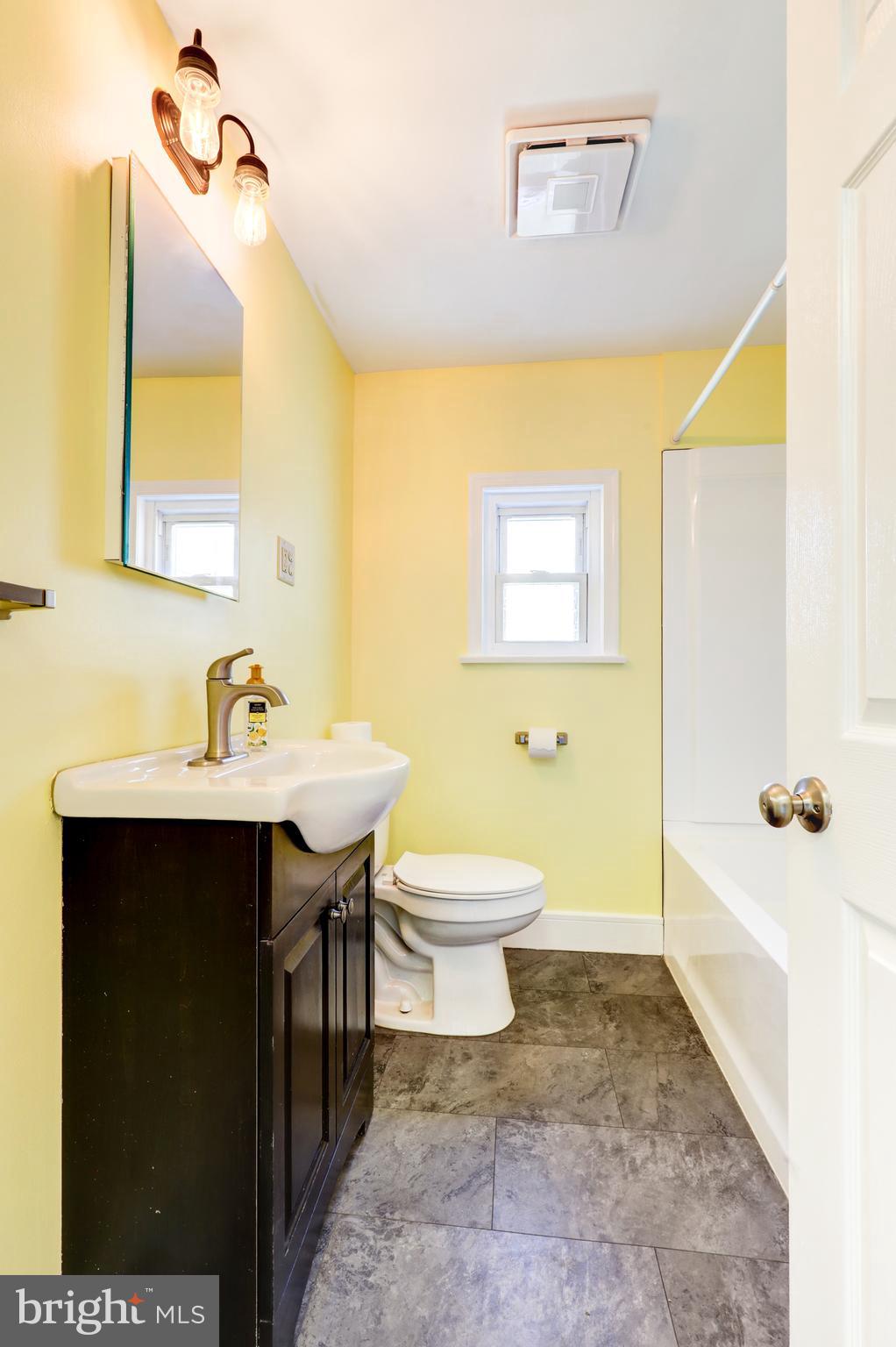 215 Akron Road Ephrata, PA 17522 - Photo 16 of 24 a bathroom with a sink a toilet and mirror