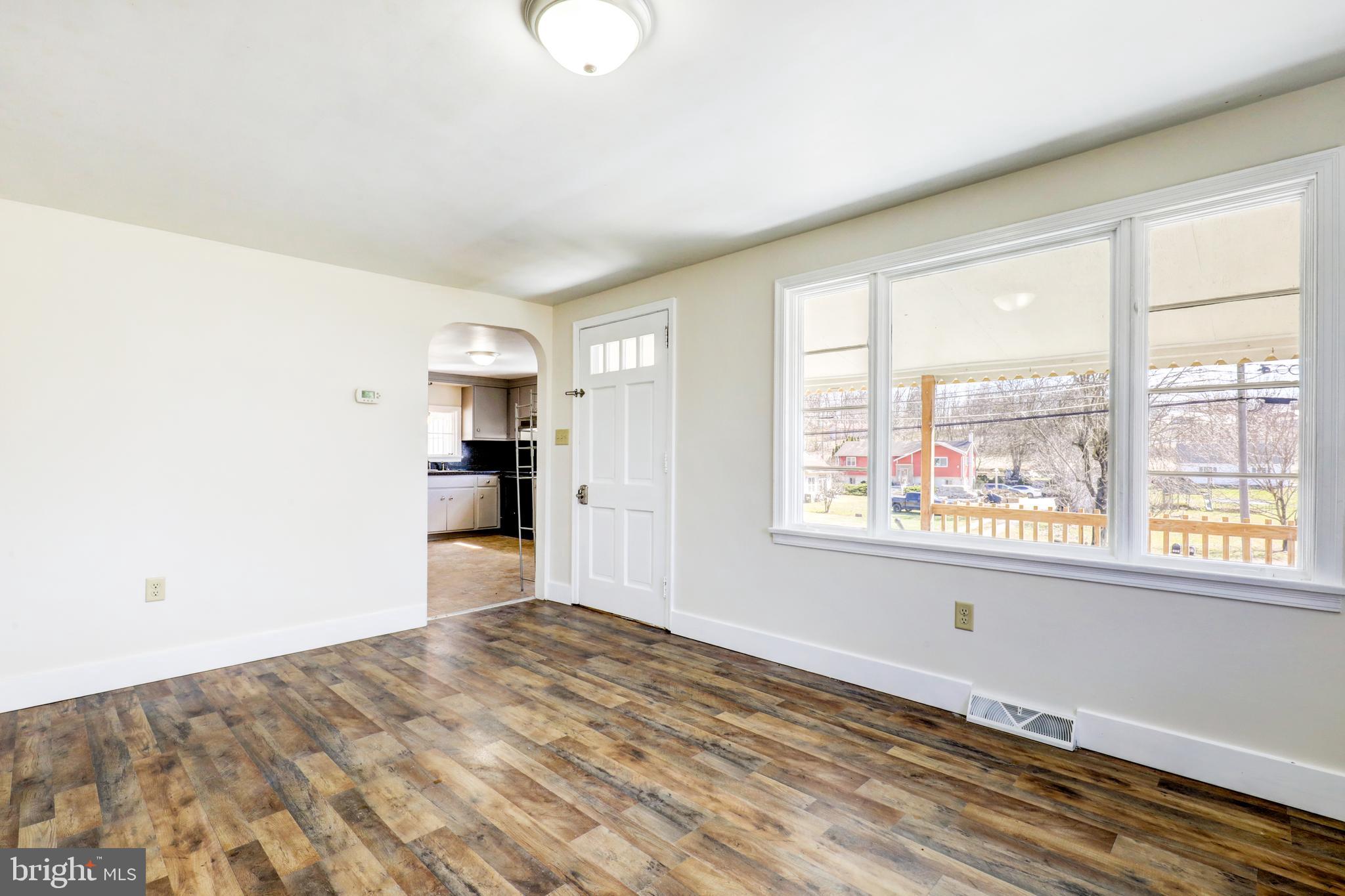 215 Akron Road Ephrata, PA 17522 - Photo 4 of 24 a view of empty room with wooden floor and fan