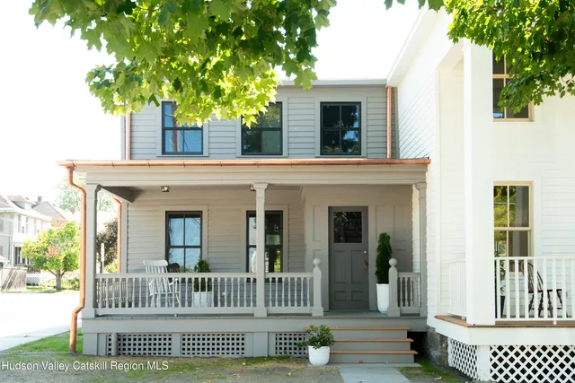 a view of house that has a deck