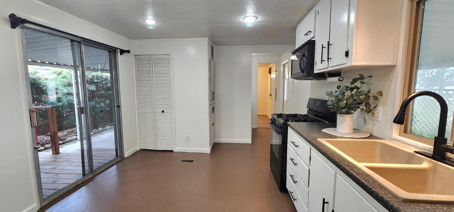 1300 West Olson Avenue, Unit 179 Reedley, CA 93654 - Photo 12 of 39 a kitchen with stainless steel appliances granite countertop a sink stove and refrigerator