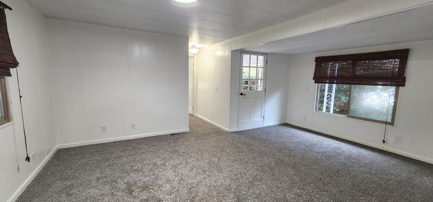 1300 West Olson Avenue, Unit 179 Reedley, CA 93654 - Photo 18 of 39 an empty room with windows