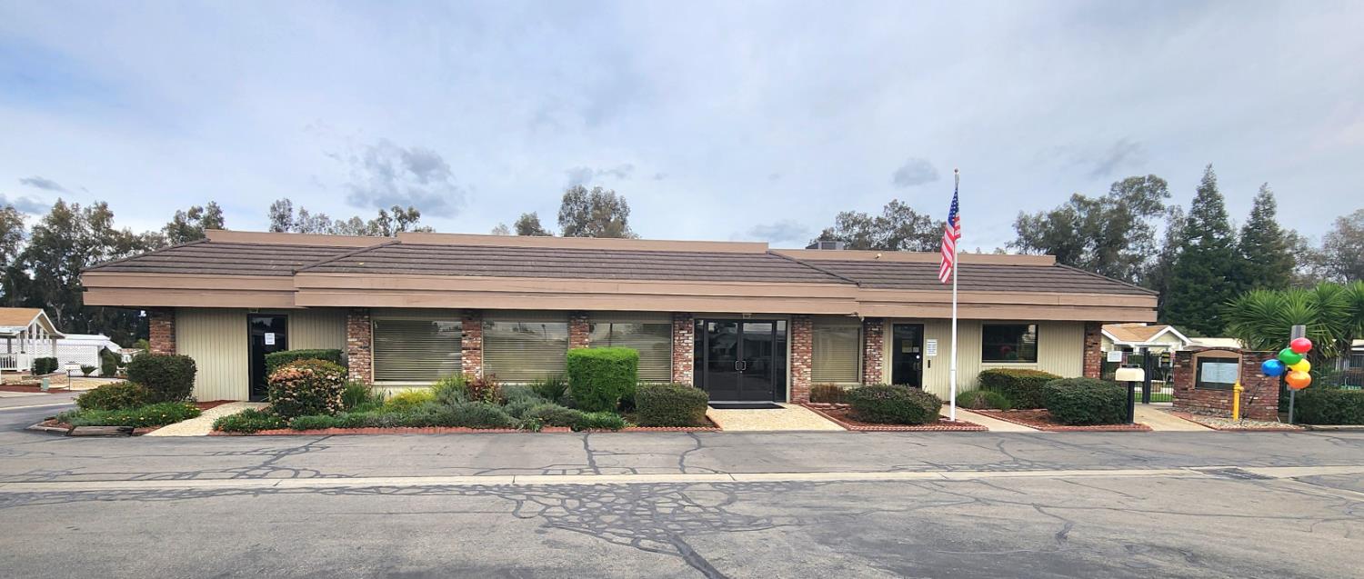 1300 West Olson Avenue, Unit 179 Reedley, CA 93654 - Photo 21 of 39 a front view of a house with garden