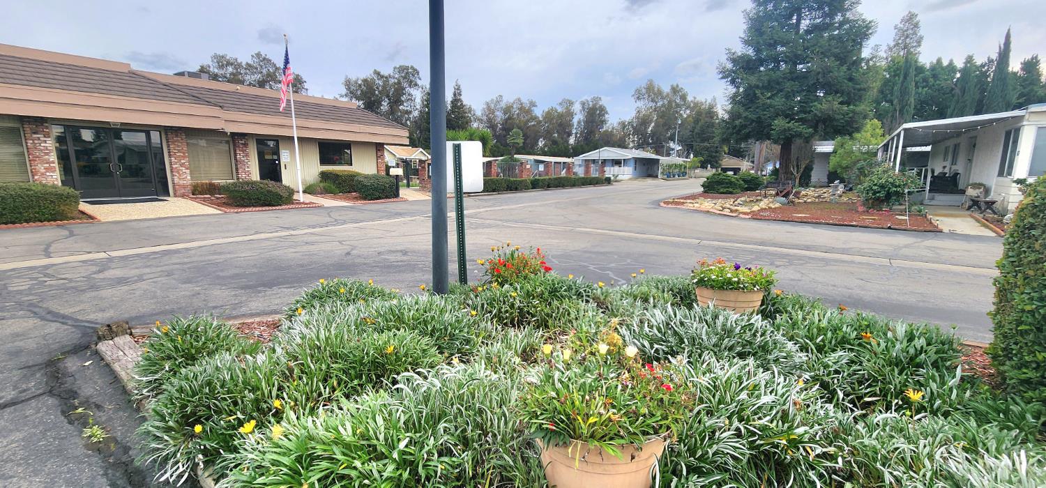 1300 West Olson Avenue, Unit 179 Reedley, CA 93654 - Photo 25 of 39 a view of a street with houses on both side