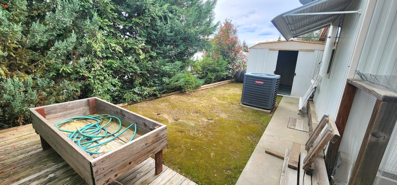 1300 West Olson Avenue, Unit 179 Reedley, CA 93654 - Photo 31 of 39 a view of a patio with chairs