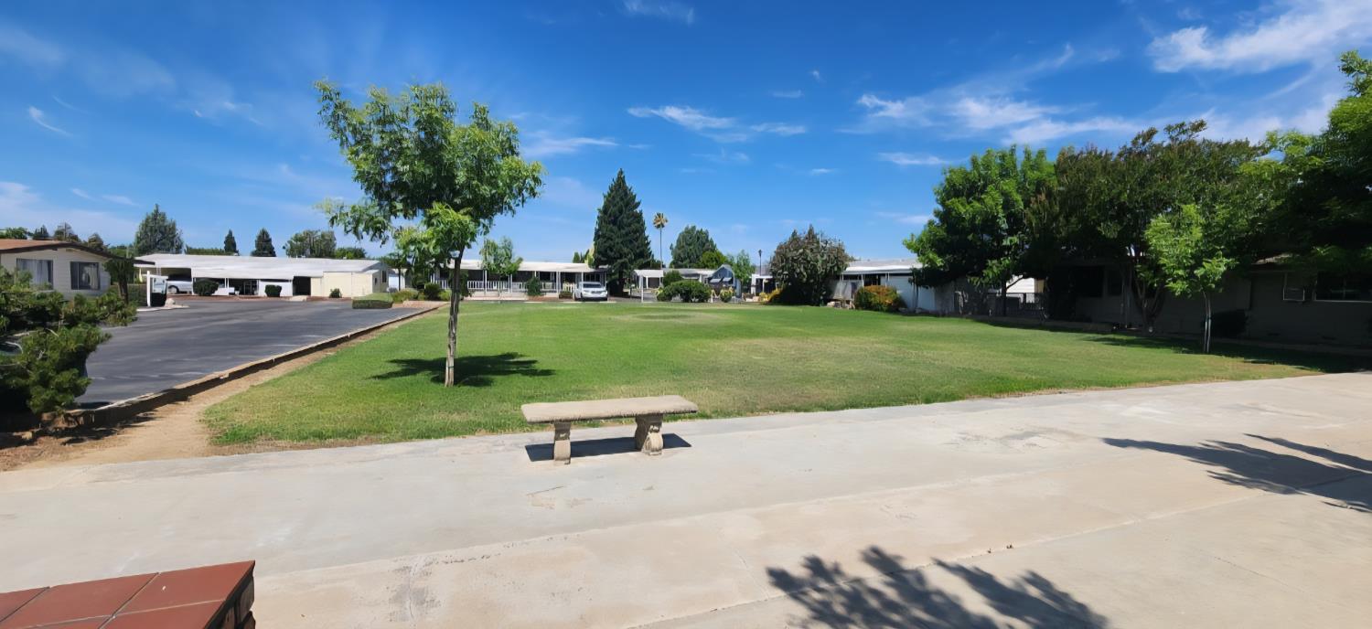 1300 West Olson Avenue, Unit 179 Reedley, CA 93654 - Photo 36 of 39 a view of a park with houses