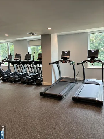 a bedroom with bed and window