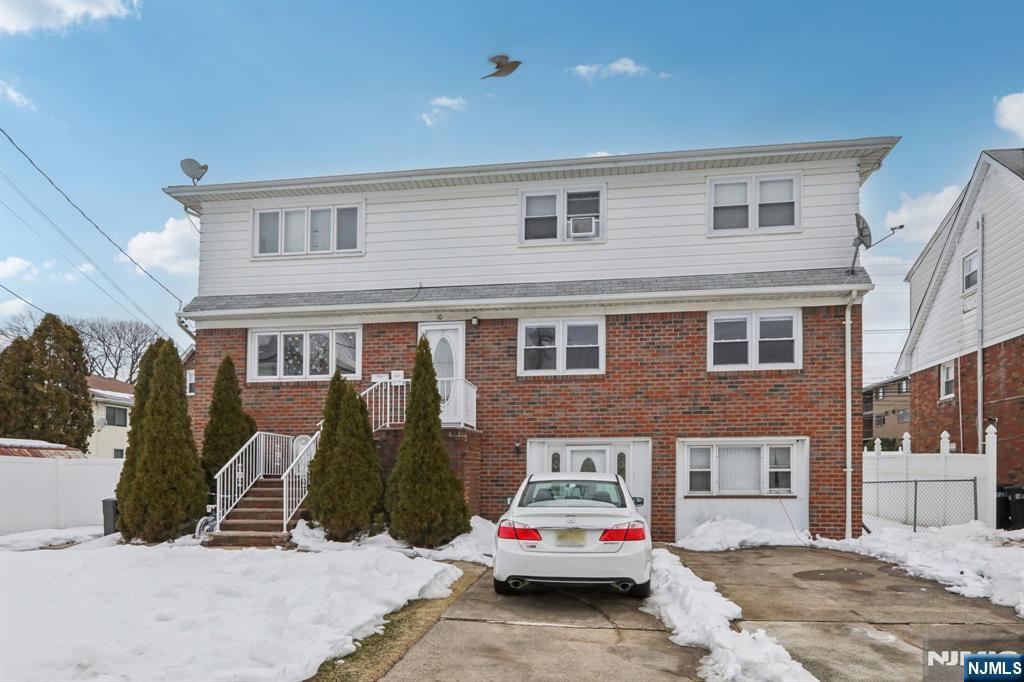 10 Millo Place, Unit 1 Little Ferry, NJ 07643 - Photo 1 of 42 a car parked in front of a building
