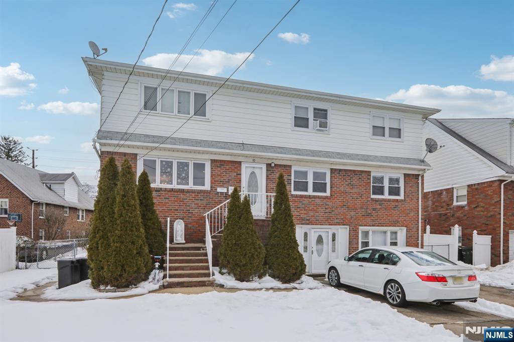 10 Millo Place, Unit 1 Little Ferry, NJ 07643 - Photo 2 of 42 a car parked in front of a building