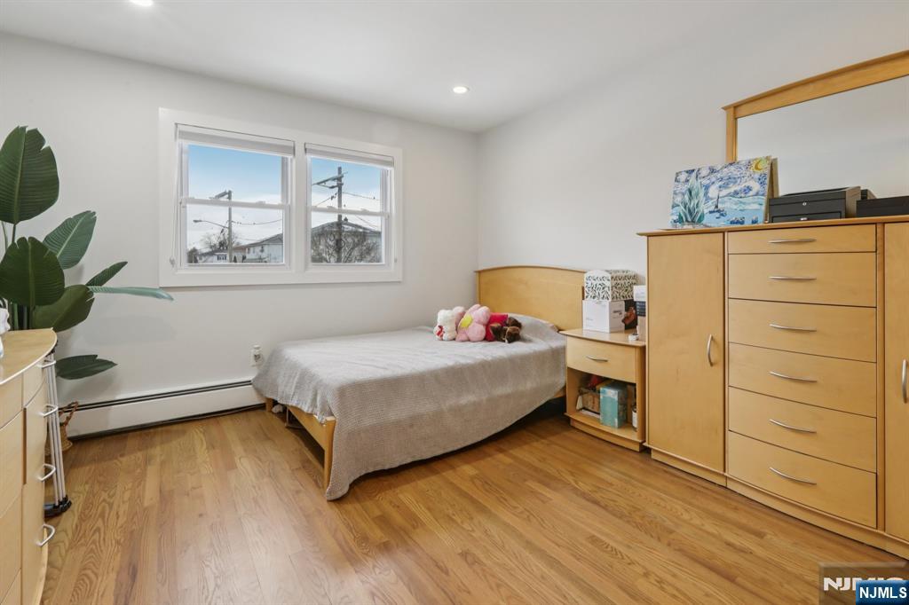 10 Millo Place, Unit 1 Little Ferry, NJ 07643 - Photo 27 of 42 a bedroom with a bed and a window