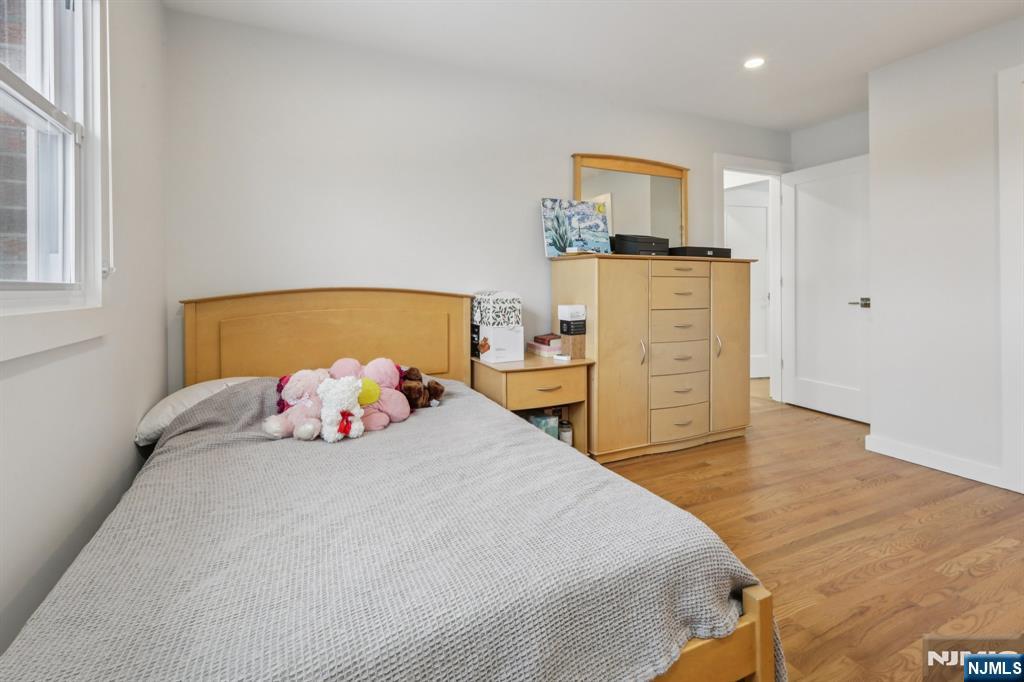 10 Millo Place, Unit 1 Little Ferry, NJ 07643 - Photo 28 of 42 a bedroom with a bed and a dresser