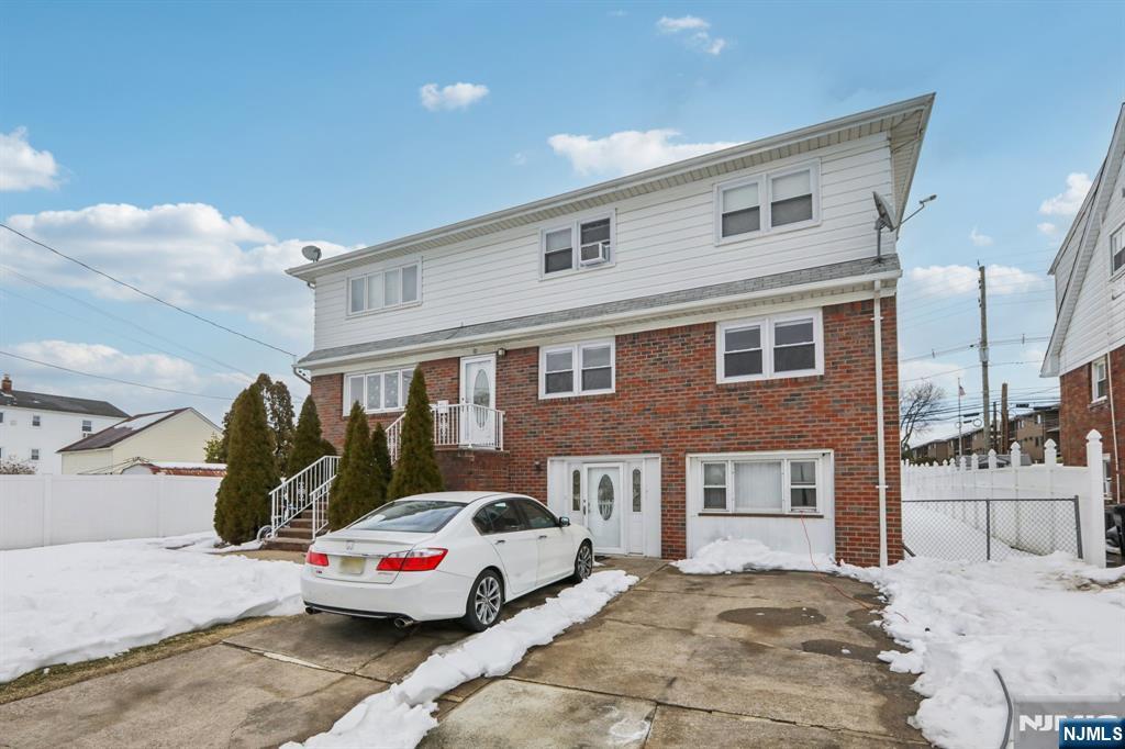 10 Millo Place, Unit 1 Little Ferry, NJ 07643 - Photo 3 of 42 a yellow and red car parked in front of a building
