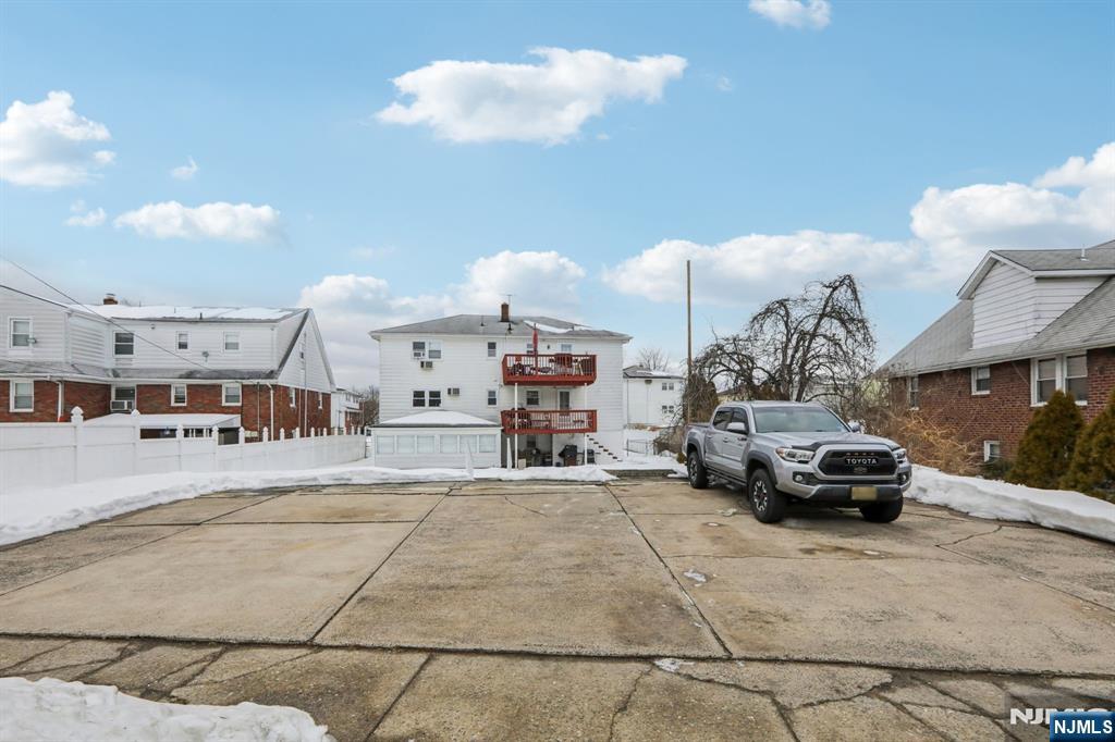 10 Millo Place, Unit 1 Little Ferry, NJ 07643 - Photo 42 of 42 a car parked in front of a building