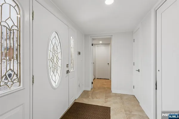 a view of a entryway door with stairs