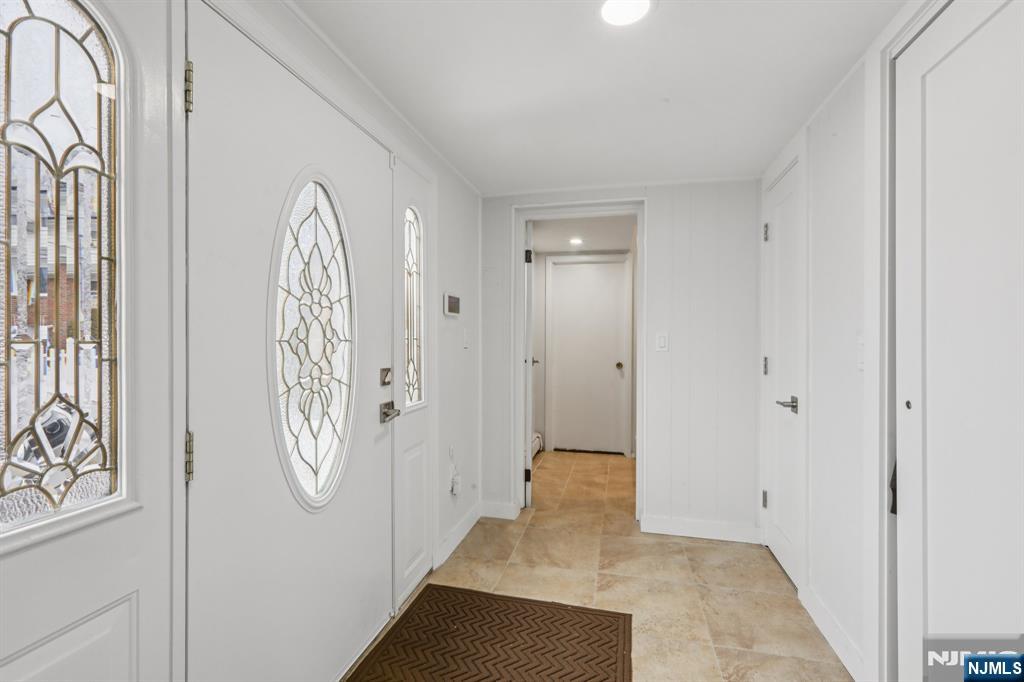 10 Millo Place, Unit 1 Little Ferry, NJ 07643 - Photo 6 of 42 a view of a entryway door with stairs