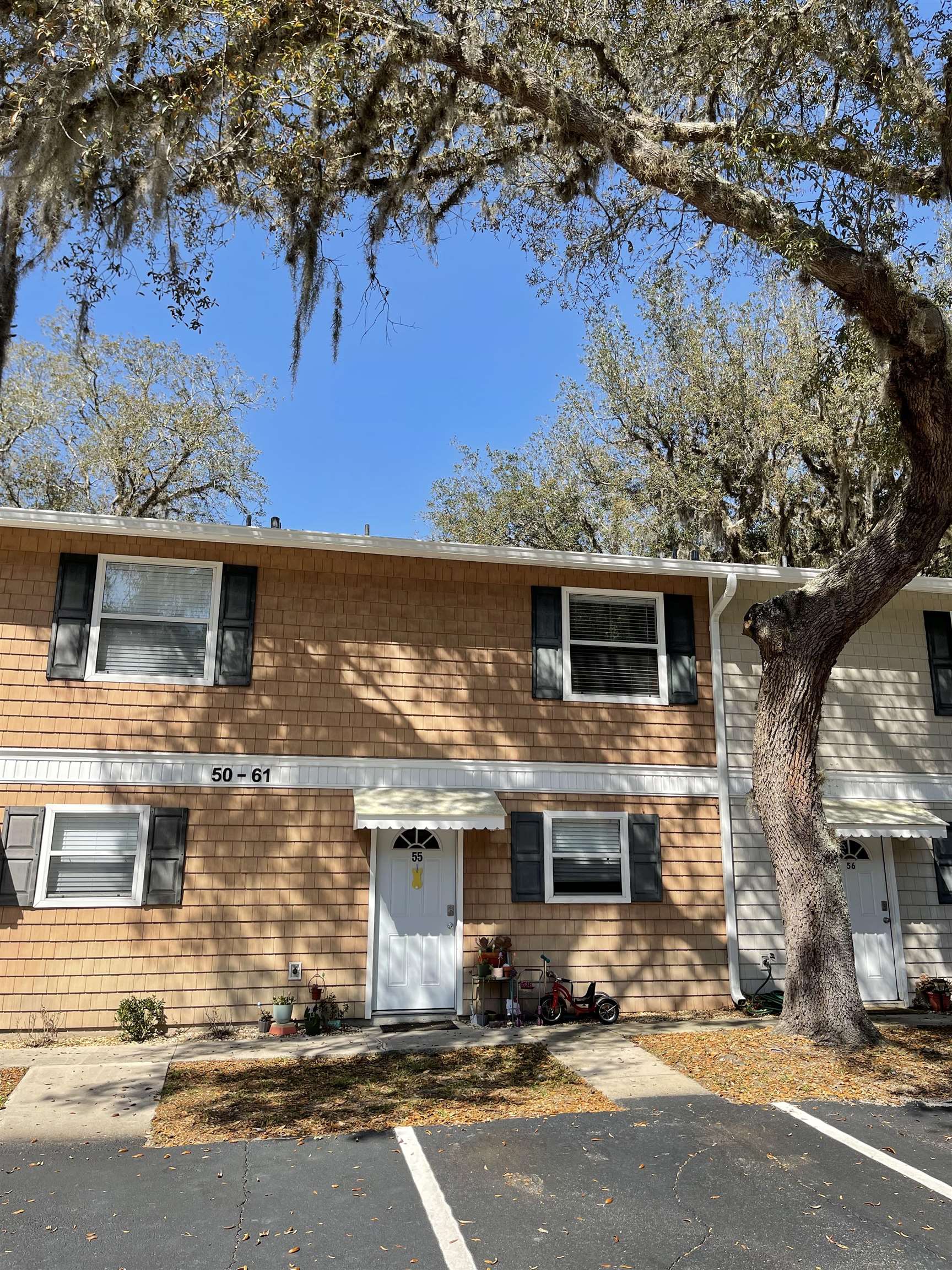 4420 Carter Road, Unit 55 St. Augustine, FL 32086 - Photo 1 of 1 a front view of a house with yard tree s