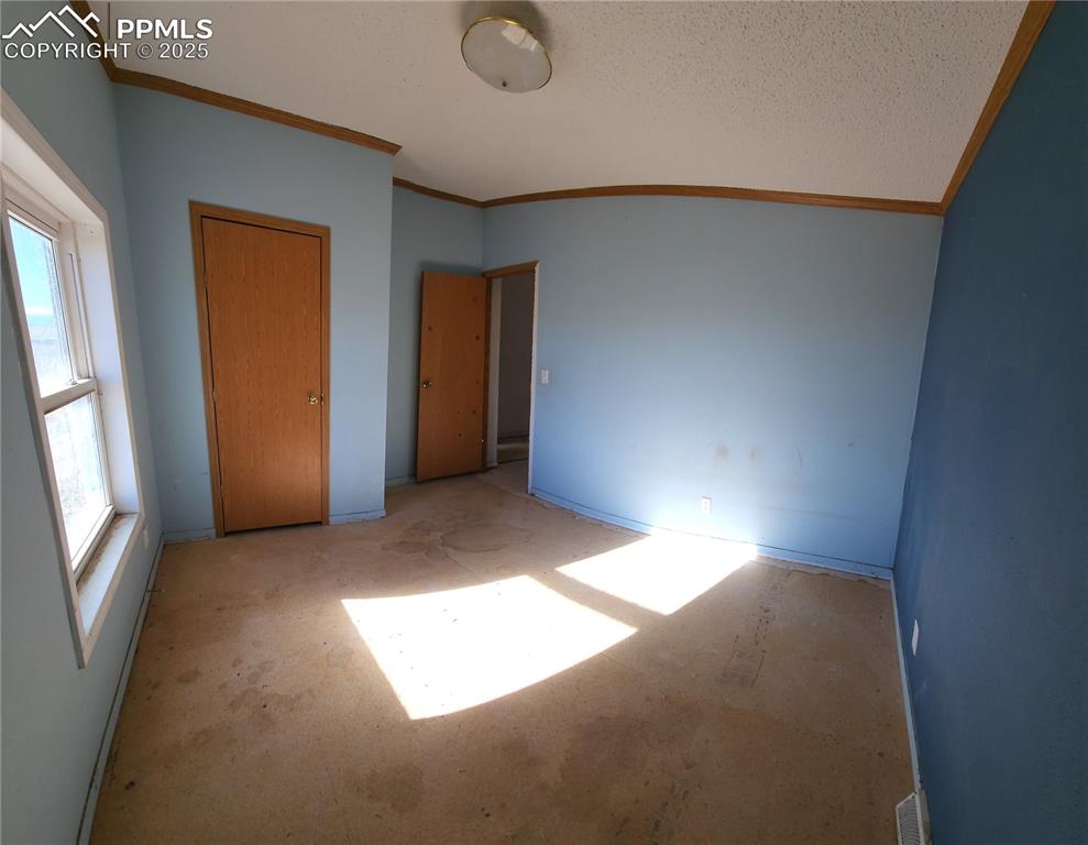 5510 Whipshaw Road Peyton, CO 80831 - Photo 12 of 18 a view of empty room with windows