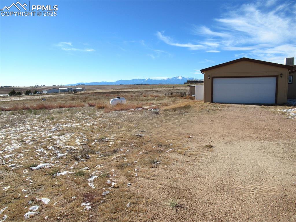 5510 Whipshaw Road Peyton, CO 80831 - Photo 3 of 18 a house with a field