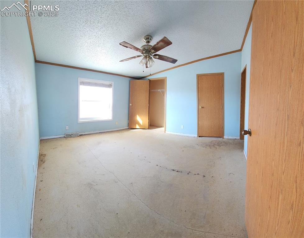 5510 Whipshaw Road Peyton, CO 80831 - Photo 8 of 18 a view of a livingroom with a ceiling fan and window