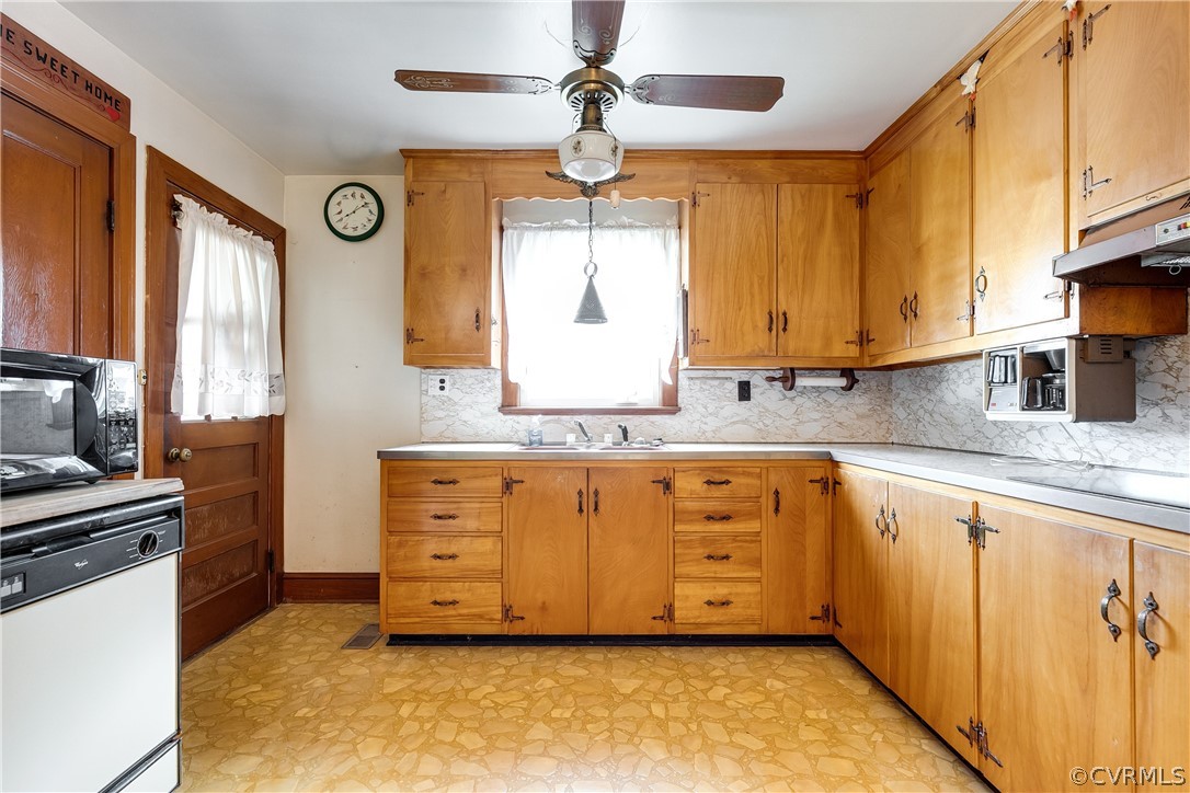 20404 Anderson Mill Road Beaverdam, VA 23015 - Photo 12 of 40 a kitchen with granite countertop white cabinets and window