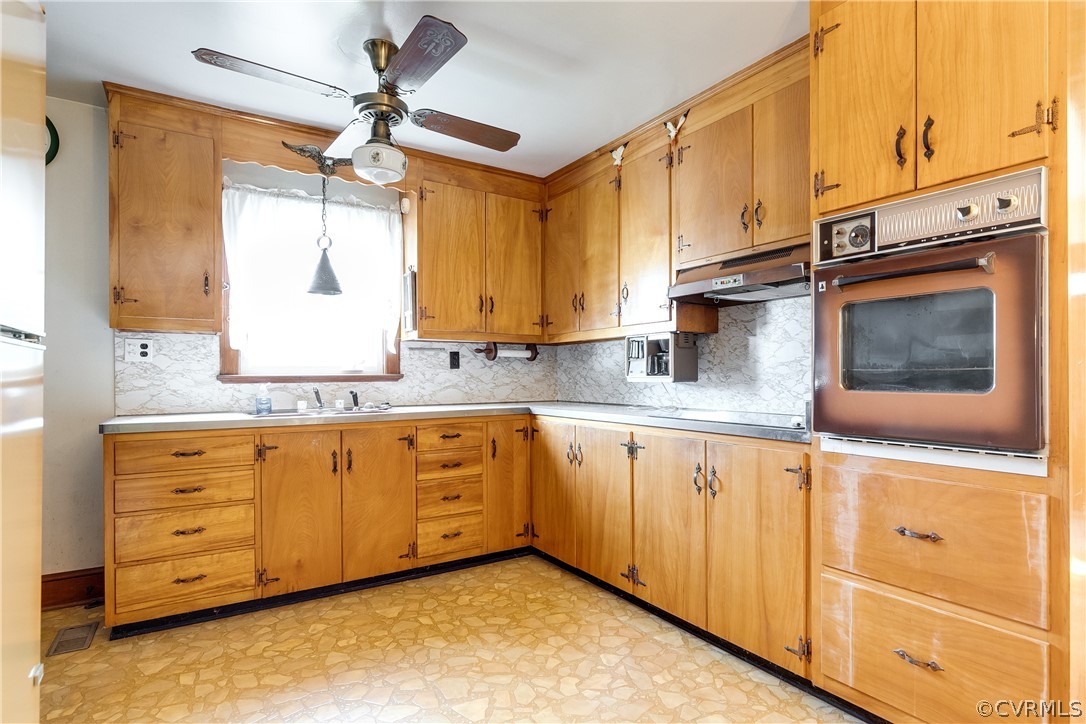 20404 Anderson Mill Road Beaverdam, VA 23015 - Photo 13 of 40 a kitchen with granite countertop a sink cabinets stainless steel appliances and a window